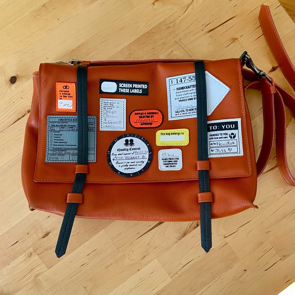 Min & Mon reversible leather messenger bag with orange and blue front flaps